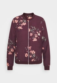 Burgundská bomber bunda s květinovým potiskem v růžové a zelené barvě. Disponuje zipovým zapínáním a ribovanými manžetami a spodním lemem. Měkká textilie.