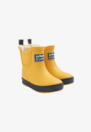 Gelbe Gummistiefel mit strukturierter Oberfläche, dunkelblauen Sohlen und einem Fleecefutter. Mit seitlichen Griffen für ein einfaches Anziehen. Sichtbares JoJo Maman Bébé-Logo.