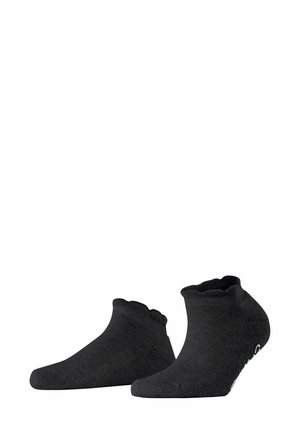Chaussettes noires à coupe basse en matériau doux, avec une bordure à volants et un détail de orteil renforcé. Présente un logo de la marque discret sur le côté.