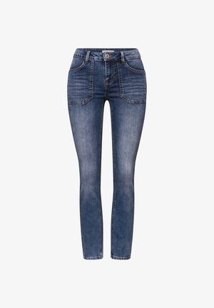 Jeans blu a vita bassa e taglio aderente in denim con tasche frontali a toppa, chiusura con bottoni e leggera sbiaditura su cosce e ginocchia.