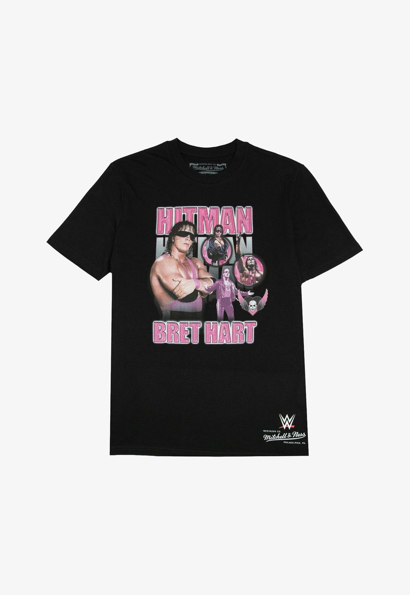 Black cotton t-shirt featuring a graphic print of wrestler Bret Hart, with pink text reading "HITMAN" and multiple circular images of Hart.