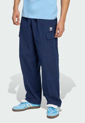 Navy blue cargo pants made of fabric with a textured finish, featuring multiple pockets and white Adidas logo on the front.