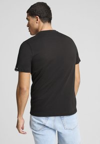 Puma MIT AUTOGRAFIK - T-shirts print - black