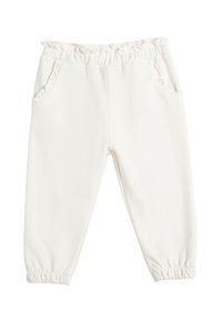 Pantalones de forro polar blancos con cintura elástica y borde con volantes. Cuenta con dos bolsillos laterales y puños elásticos en el tobillo. Textura suave.