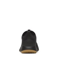 Schwarzer Sportschuh mit einem strukturierten Textilobermaterial, abgerundetem Absatz und einer Gummisohle in kontrastierendem Beige. Mit einem Zugschlaufen an der Rückseite.