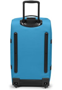 Valigia blu con guscio rigido, manico nero retrattile, ruote durevoli e dettagli neri. Design semplice e funzionale.