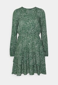 Vihreä kuviollinen mekko kevyestä kankaasta, jossa on pitkät hihat, pyöreä pääntie, kerroksellinen röyhelöhelma ja joustava vyötärö, joka muotoilee mekkoa.