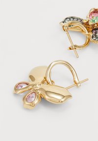 Gold-tone butterfly earrings featuring pink and green gemstones, a polished finish, and a hinged clasp for secure wear.