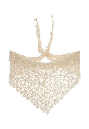 Top con scollo halter in pizzo all'uncinetto color crema con motivi floreali e nodo frontale su sfondo bianco.