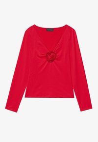 Rotes Langarmshirt mit tiefem V-Ausschnitt und einer Stoffblumendekoration in der Mitte. Hergestellt aus glattem Material mit einer figurnahen Silhouette.