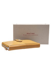 Yellow leather wallet with a snap closure and zipper; features a smooth texture. Boxed packaging with "Maitre Finest Leathergoods" label.