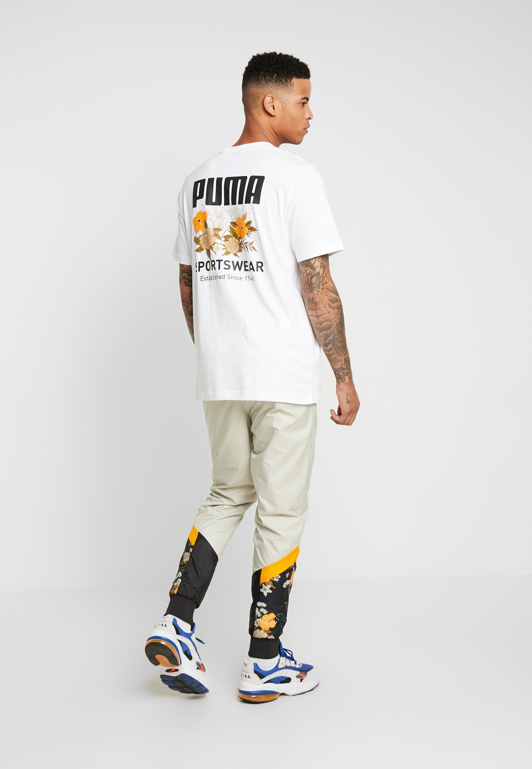 beige puma tracksuit