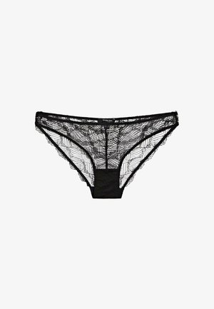 Tanga in pizzo nero con motivo intricati, texture trasparente e tessuto morbido. Completato con una vita solida.