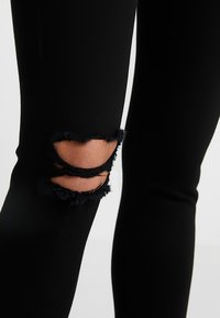 Topshop Petite Vaqueros pitillo - black