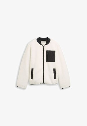 Giacca bianca e soffice con una tasca in nylon nera con zip, tasche laterali e colletto a costine. Presenta una chiusura con zip e accenti neri a contrasto.