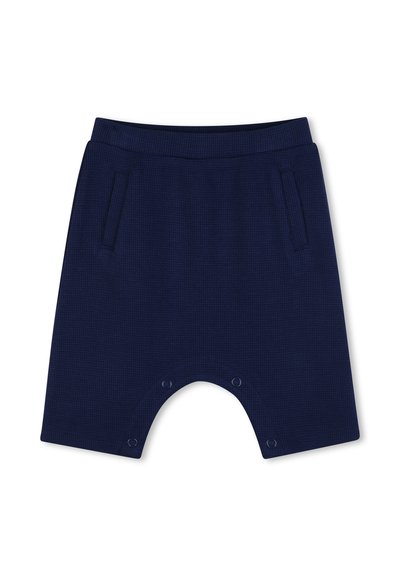 Shorts pour bébé bleu marine avec ceinture élastique, poches latérales et boutons-pression à l'entrejambe pour faciliter le changement de couche.
