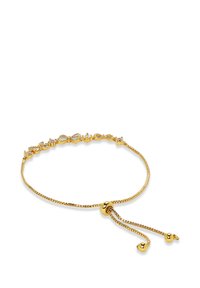 Gold bracelet with an adjustable chain. Features decorative elements like bows and beads, finished with two dangling gold accents.