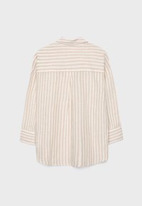 Beige-weiß gestreiftes Langarmshirt mit vertikalen Streifen am Körper und horizontalen Streifen am oberen Rücken und an den Bündchen, flachliegend präsentiert.