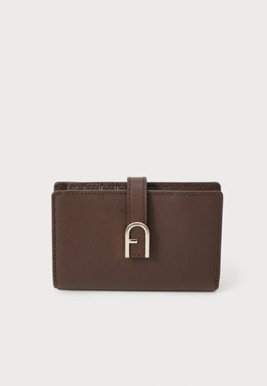 Brown leather wallet with a smooth texture, featuring a gold-toned hardware clasp and a raised logo accent. Compact rectangular shape.