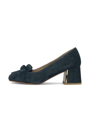 Zapato de tacón bloque bajo de ante azul marino con lazo decorativo y detalle de flecos en la parte delantera y acento dorado en la base del tacón.
