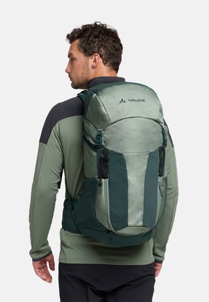 Zaino Vaude verde dal design elegante, con una parte frontale testurizzata, spallacci regolabili e numerose tasche. Realizzato in materiale resistente.