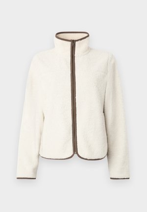 Fleece jack, off-white met een zachte textuur, hoge kraag en een bruine rits. Heeft een rechte snit en een contrasterende bruine bies langs de randen.