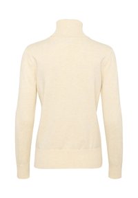 Cream-colored turtleneck sweater made of soft fabric, featuring a fitted design and ribbed cuffs and hem, with a smooth texture.