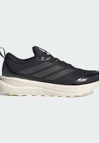 Black athletic shoe with dark gray stripes, black laces, and thick white cushioned sole labeled Cloudfoam, shown from the outer side on a white background.