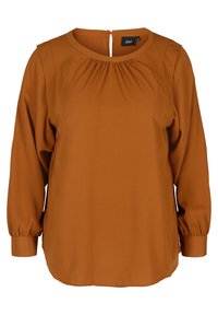Blusa a maniche lunghe color ruggine con scollatura arrotondata, dettagli arricciati e chiusura con bottoni sul retro. Tessuto morbido e liscio.