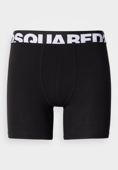 Črne boksarice iz mehke, elastične tkanine. Imajo širok pas z belim napisom "DSQUARED2", ki nudi udobje in podporo.