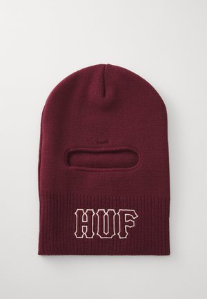 Balaclava en tricot bordeaux avec une ouverture pour les yeux horizontale et "HUF" brodé en blanc sur le bas à l'avant.