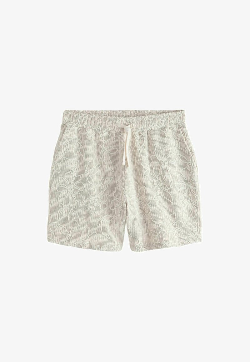Pletene bele kratke hlače z elastičnim pasom, zavezovanjem z vrvico, stranskimi žepi in subtilnim cvetličnim vzorcem po celotnem materialu.