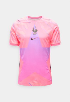 Pink og lilla sportstrøje med stort stjernedesign, Nike-logo og det franske fodboldforbunds haner-mærke med to stjerner over.