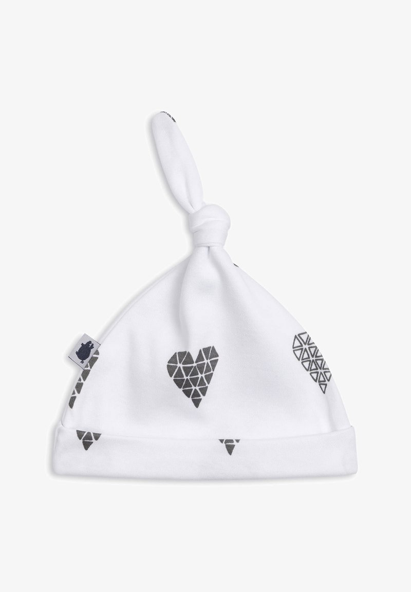 Hvid stofhat med en knude-design på toppen, der har geometriske sorte hjerter og trekantsmønstre overalt. Blødt bomuldsmateriale.