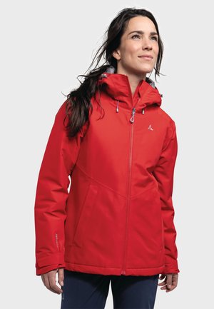 Red waterproof jacket with a high collar, adjustable hood, and front zipper. Features elastic cuffs and a geometric design.