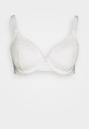 Soutien-gorge blanc avec armatures, orné de délicates broderies florales sur les bonnets, possédant des bretelles réglables et des finitions en forme de vagues le long des bords.