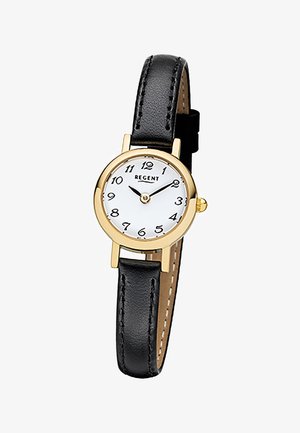 Montre ronde en or avec cadran blanc, chiffres arabes noirs, aiguilles des heures et des minutes noires, et bracelet en cuir noir.