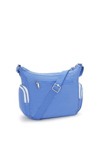 Blue nylon crossbody bag with a textured surface, adjustable strap, front zip pocket, and side mesh pockets.