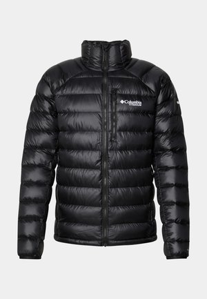 Black puffer jacket with a high collar, zippered front, and logo on the chest. Features quilted, glossy panels and elastic cuffs.