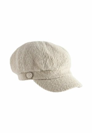 Beige Kordmütze mit runder Form, ausgestattet mit einem kleinen Knopfdetail an der Seite und gerippter Textur im gesamten Stoff.