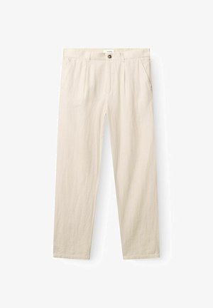 Bež široke hlače ravnog kroja s bočnim džepovima, omčama za remen, zatvaračem na gumb i vidljivom oznakom robne marke na pojasu.