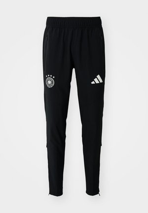 Čierne športové nohavice s elastickým pásom, so zipsovými vreckami, s logom nemeckej futbalovej federácie a bielymi pruhmi adidas.