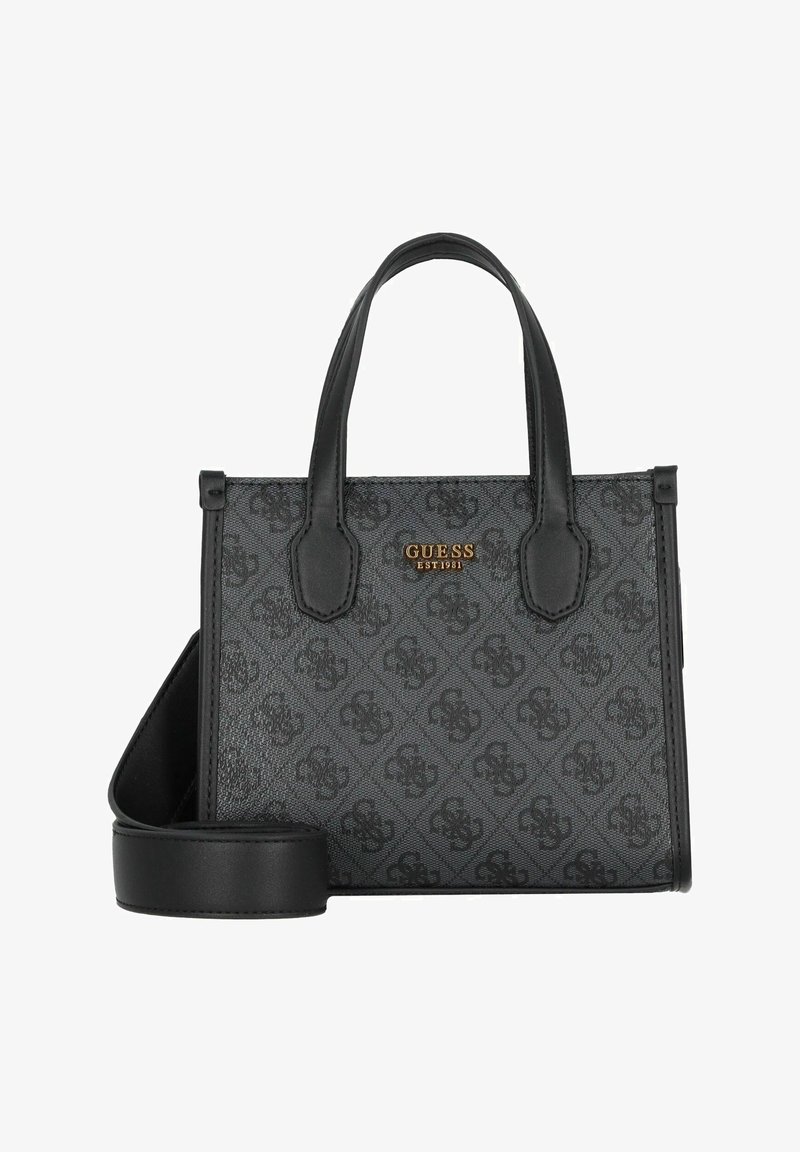 Sac à main noir en matériau texturé, présentant un design à motifs et un logo doré. Comprend des poignées courtes et une bandoulière amovible.