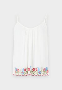 Haut blanc sans manches avec fines bretelles et motif floral brodé rouge, bleu et vert le long de l'ourlet festonné.
