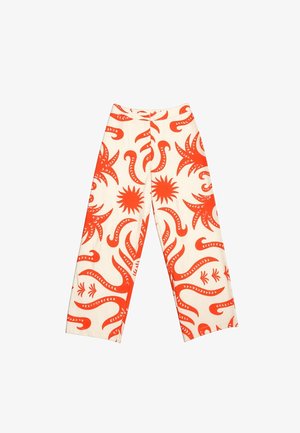 Άσπρο παντελόνι σε φαρδύ κόψιμο με έντονα πορτοκαλί αφηρημένα σχέδια ήλιου και πλοκαμιών, φερμουάρ μπροστά και χωρίς ορατές τσέπες.