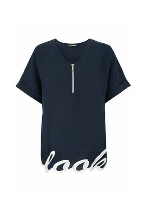 Navy short-sleeve top with half zipper front and white cursive text "look" along the scalloped hem.