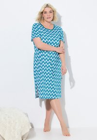 Abito maniche corte di colore blu con motivo a conchiglie, caratterizzato da un collo rotondo e una linea di lunghezza intermedia. Tessuto morbido e leggera texture.