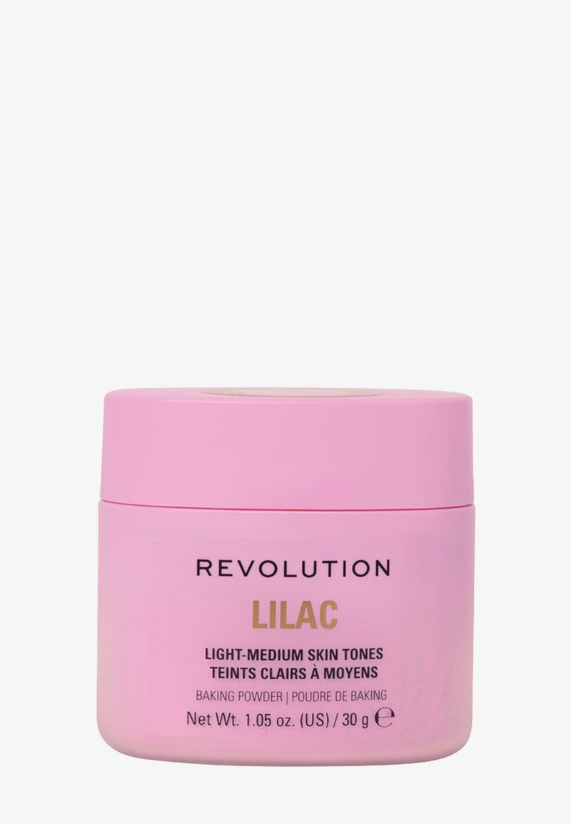Rosa behållare med bakpulver märkt "Revolution Lilac" för ljus-medel hudton. Innehåller 30g. Slät textur, cirkulär form.