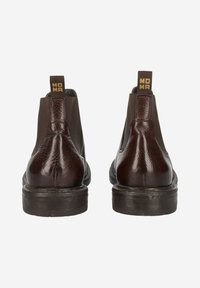 Braune Leder-Stiefeletten mit einem strukturierten Einsatz, elastischen Seiten und einer schwarzen Gummisohle. Markenlabel am Zugband auf der Rückseite.