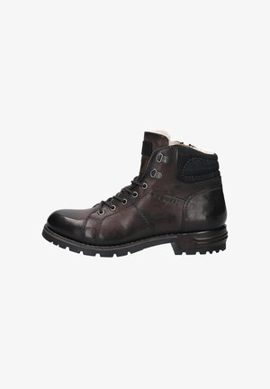 Braune Lederstiefelette mit runder Zehenpartie, Schnürung vorne, weichem Innenfutter, schwarzen strukturierten Akzenten und rutschfester Sohle für besseren Halt.